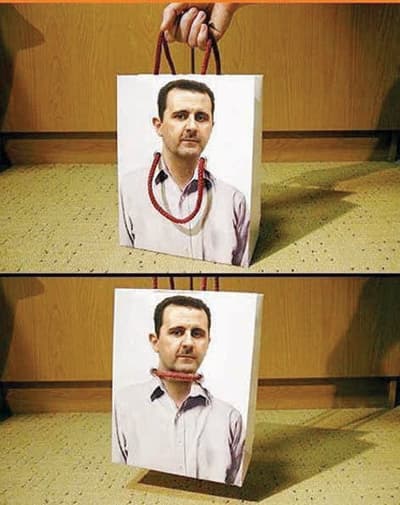 السوريون يشنقون الأسد بأكياس صنعها التجار