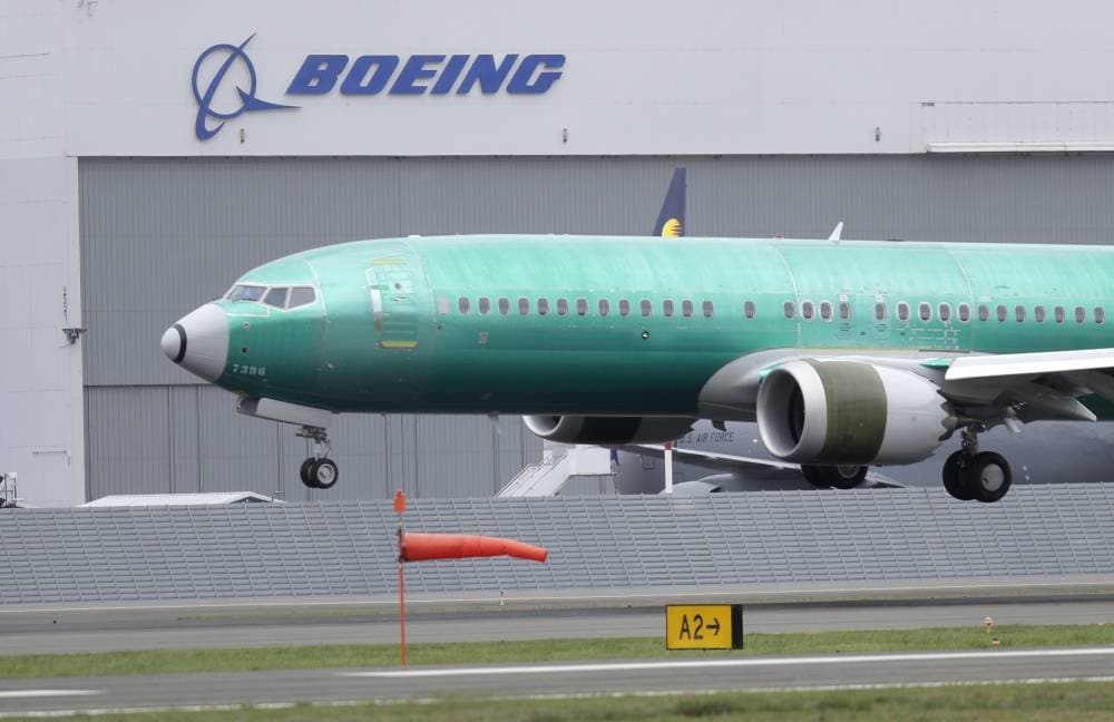 FILE - In this April 10, 2019, file photo a Boeing 737 MAX 8 airplane being built for India-based Jet Airways lands following a test flight at Boeing Field in Seattle.  Boeing says it lost $2.40 billion in the second quarter, and it's taking a more downbeat view about the airplane market because of the coronavirus outbreak. Boeing said Wednesday, July 29, 2020, it now expects the airline industry will take longer to recover from the pandemic, and that will limit aircraft sales. (AP Photo/Ted S. Warren, File)