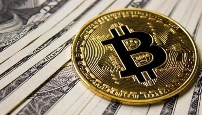 بيتكوين يتخطى 21 ألف دولار لأول مرة