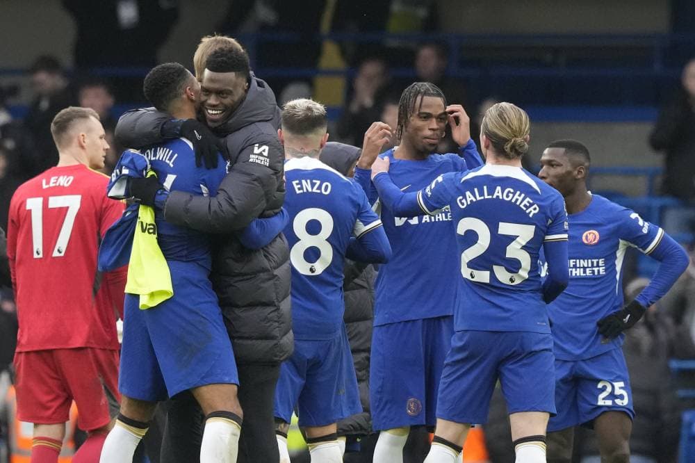 Chelsea players celebrate their victory at the English Premier League soccer match between Chelsea and Fulham at Stamford Bridge stadium in London, Saturday, Jan. 13, 2024. (AP Photo/Frank Augstein)