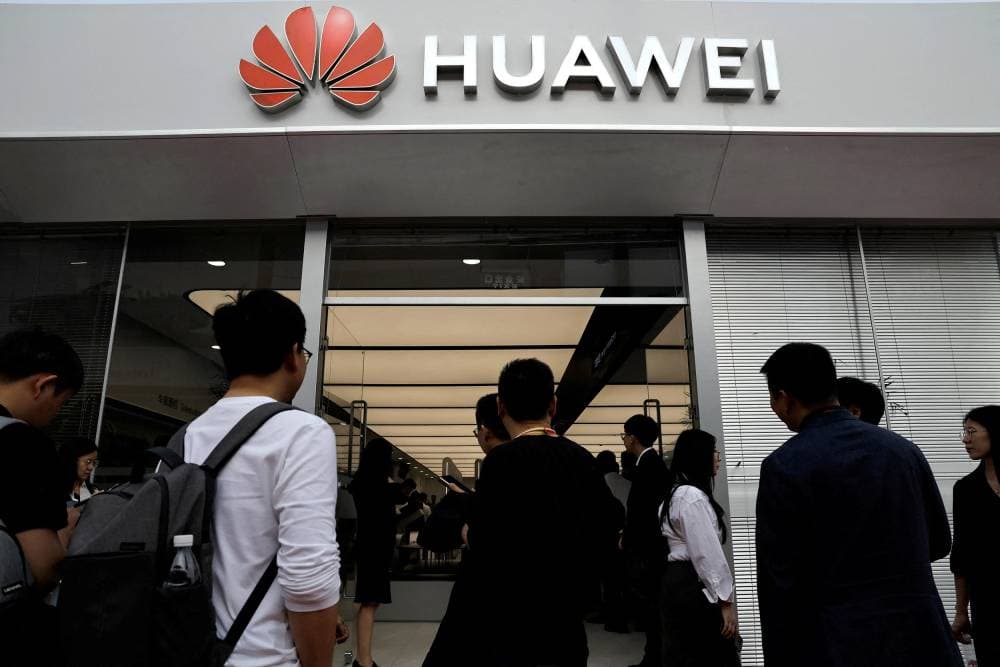 FILE PHOTO: Visitors enter Huawei booth at the Beijing International Automotive Exhibition, or Auto China 2024, in Beijing, China, April 25, 2024. REUTERS/Tingshu Wang/File Photo