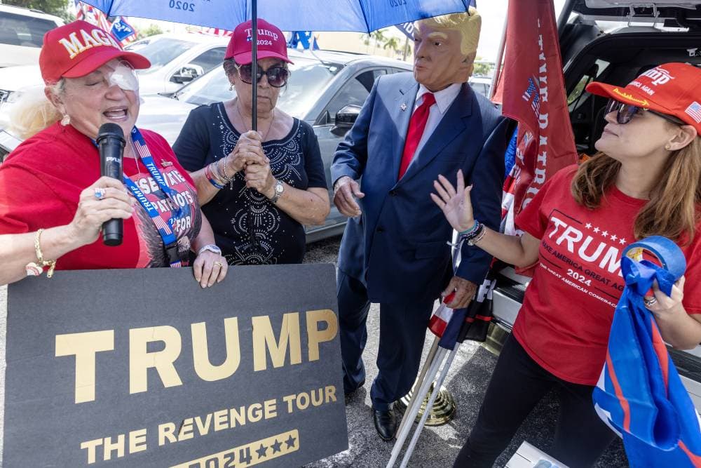 epa11477983 Supporter of former US president Donald Trump hold a demonstration in his support in Hialeah, Florida, USA, 14 July 2024. Trump was rushed off stage by secret service after an incident during a campaign rally in Pennsylvania. According to the Butler County district attorney, a suspected gunman was dead and at least one rally attendee was killed.  EPA/CRISTOBAL HERRERA-ULASHKEVICH