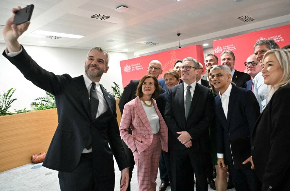South Yorkshire Mayor Oliver Coppard takes a selfie photograph with Britain's Prime Minister Keir Starmer, Wales' First Minister Eluned Morgan, Scotland's First Minister John Swinney, Northern Ireland's First Minister Michelle O'Neill and other regional Mayors during the first Council of Nations and Regions, at Queen Elizabeth House in Edinburgh, Scotland, Britain October 11, 2024.     ANDY BUCHANAN/Pool via REUTERS
