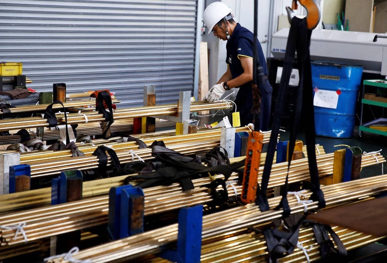 A worker at Sakai Seisakusyo prepares to transport metal rods at its factory in Kakamigahara, central Japan, July 8, 2024. REUTERS/Anton Bridge