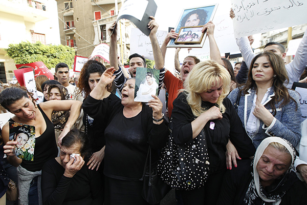 قصة مصورة : مظاهرة لبنانية ضد العنف الأسري