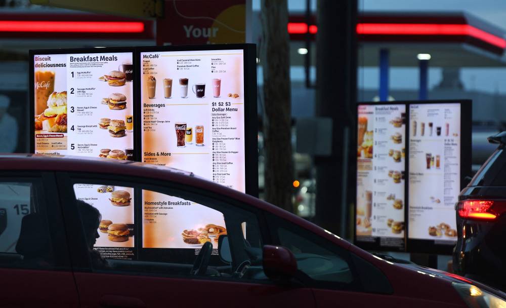 OMAHA, NEBRASKA - OCTOBER 23: A customer waits to order from the breakfast menu in the Drive Thru lane at a McDonald’s restaurant on October 23, 2024 in Omaha, Nebraska. Nearly 50 people were sickened with E.coli in ten states, with three people hospitalized in the Omaha area, after eating at McDonald’s restaurants. The E. coli outbreak has been linked to McDonald’s Quarter Pounders, according to the CDC. Mario Tama/Getty Images/AFP (Photo by MARIO TAMA / GETTY IMAGES NORTH AMERICA / Getty Images via AFP)