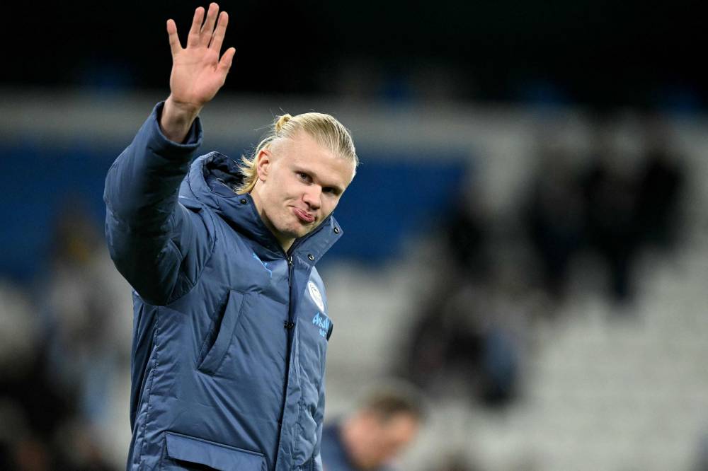 TOPSHOT - Manchester City's Norwegian striker #09 Erling Haaland waves to fans following during the UEFA Champions League football match between Manchester City and Sparta Prague at the Etihad Stadium in Manchester, north west England, on October 23, 2024. (Photo by Oli SCARFF / AFP)