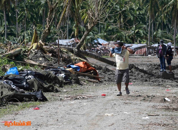 قصة مصورة : مقابر جماعية لضحايا اعصار "بوفا" في الفلبين بسب عدم تحديد هوياتهم
