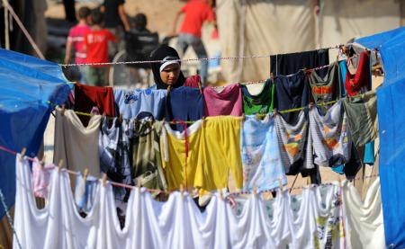 قصة مصورة : مخاوف وآمال في مخيم للاجئين السوريين