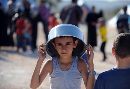 قصة مصورة : مخاوف وآمال في مخيم للاجئين السوريين
