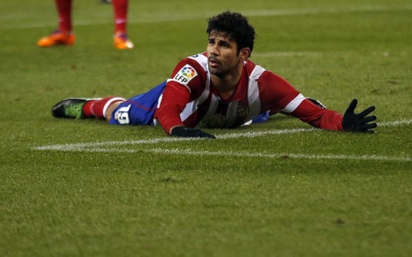 قصة مصورة : كوستا يقود أتليتكو للفوز على فالنسيا ومقاسمة برشلونة الصدارة
