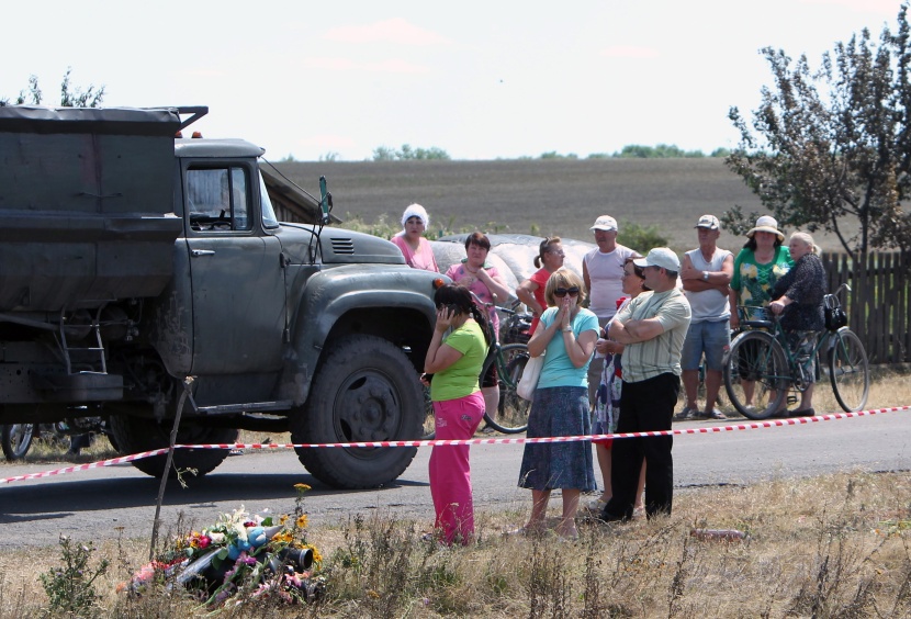 قصة مصورة: انتهاء عملية الانقاذ في حادث إسقاط الطائرة الماليزية في أوكرانيا